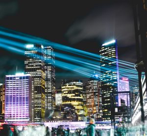 People using Internet of Things in City Downtown