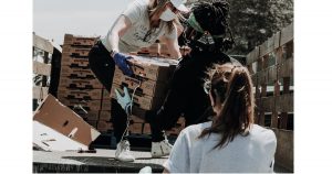 Man takes donations from back of truck